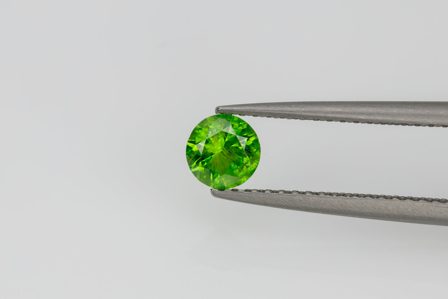 Faceted russian demantoid garnet 0.44 ct