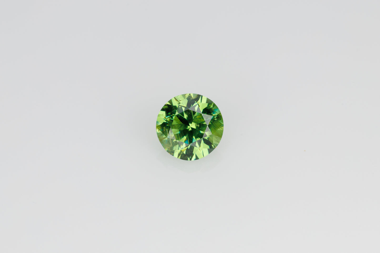 Faceted russian demantoid garnet 0.6 ct