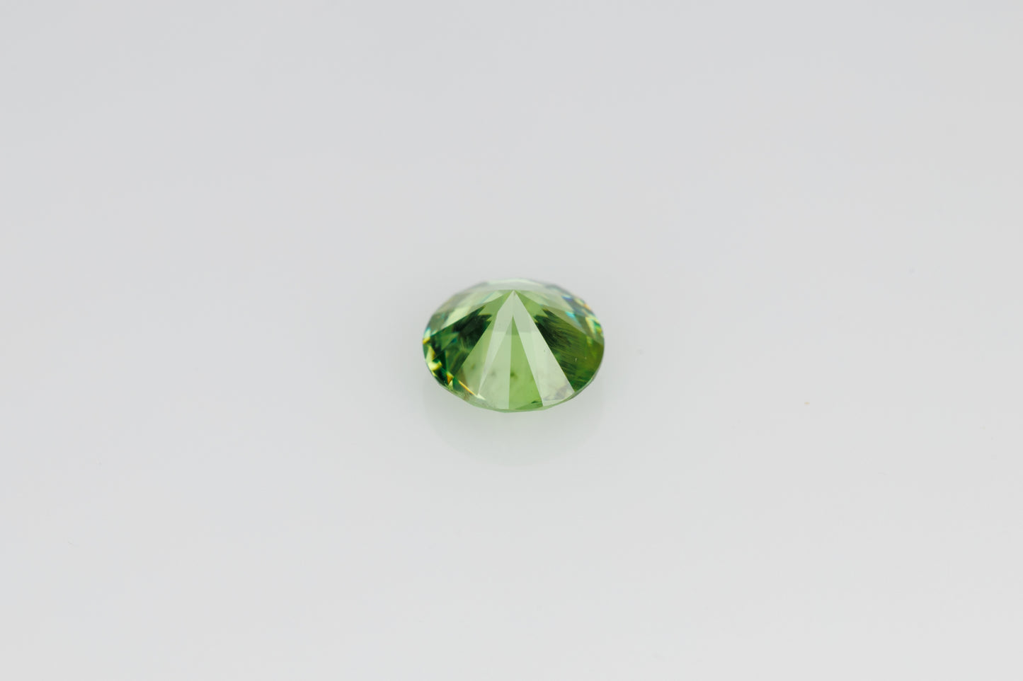 Faceted russian demantoid garnet 0.6 ct