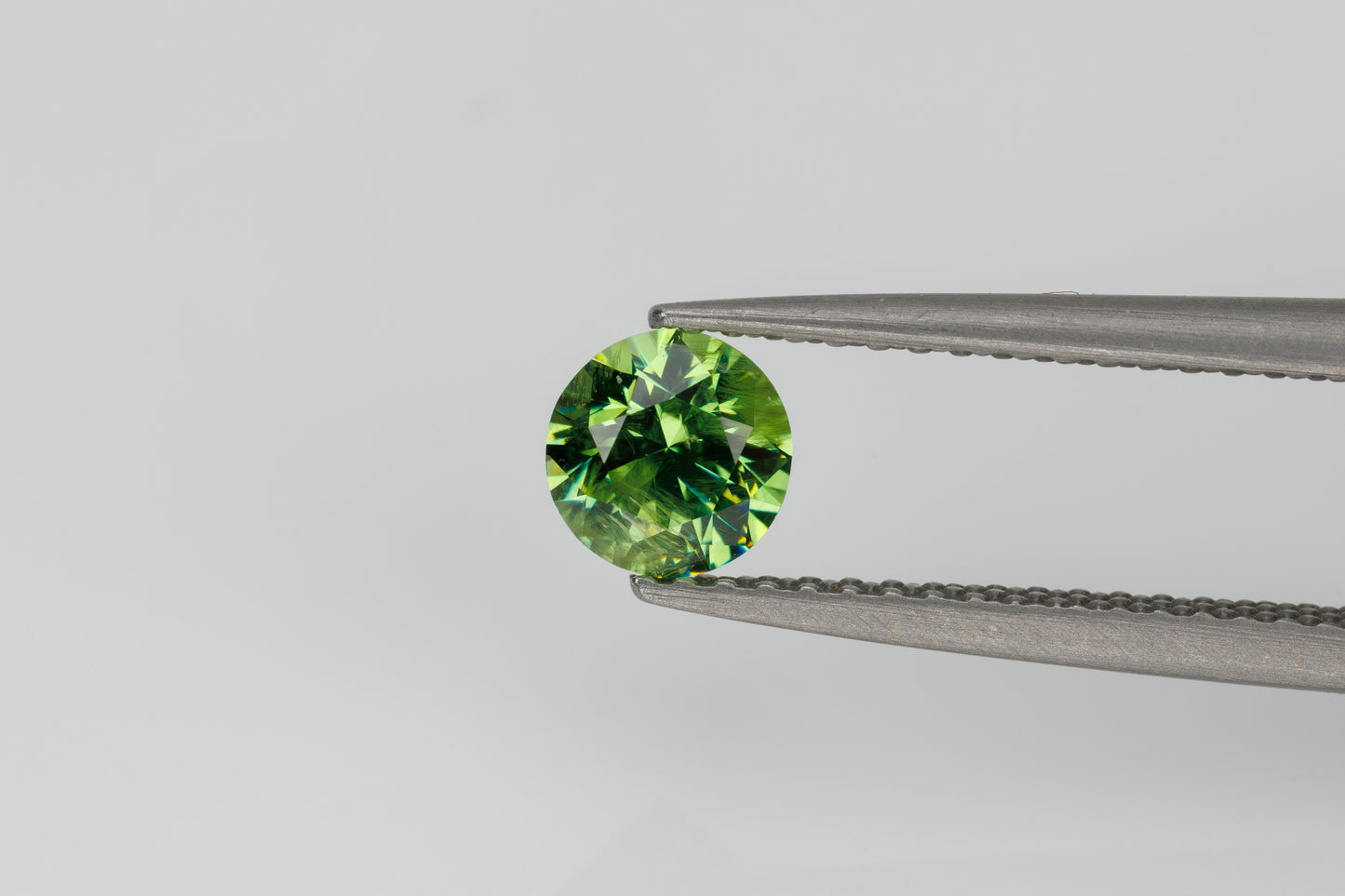 Faceted russian demantoid garnet 0.6 ct