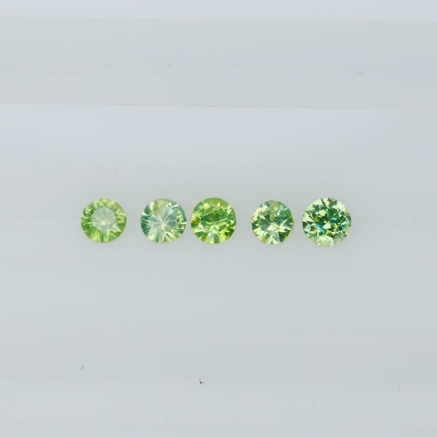 0.48 ct faceted russian demantoid garnet set