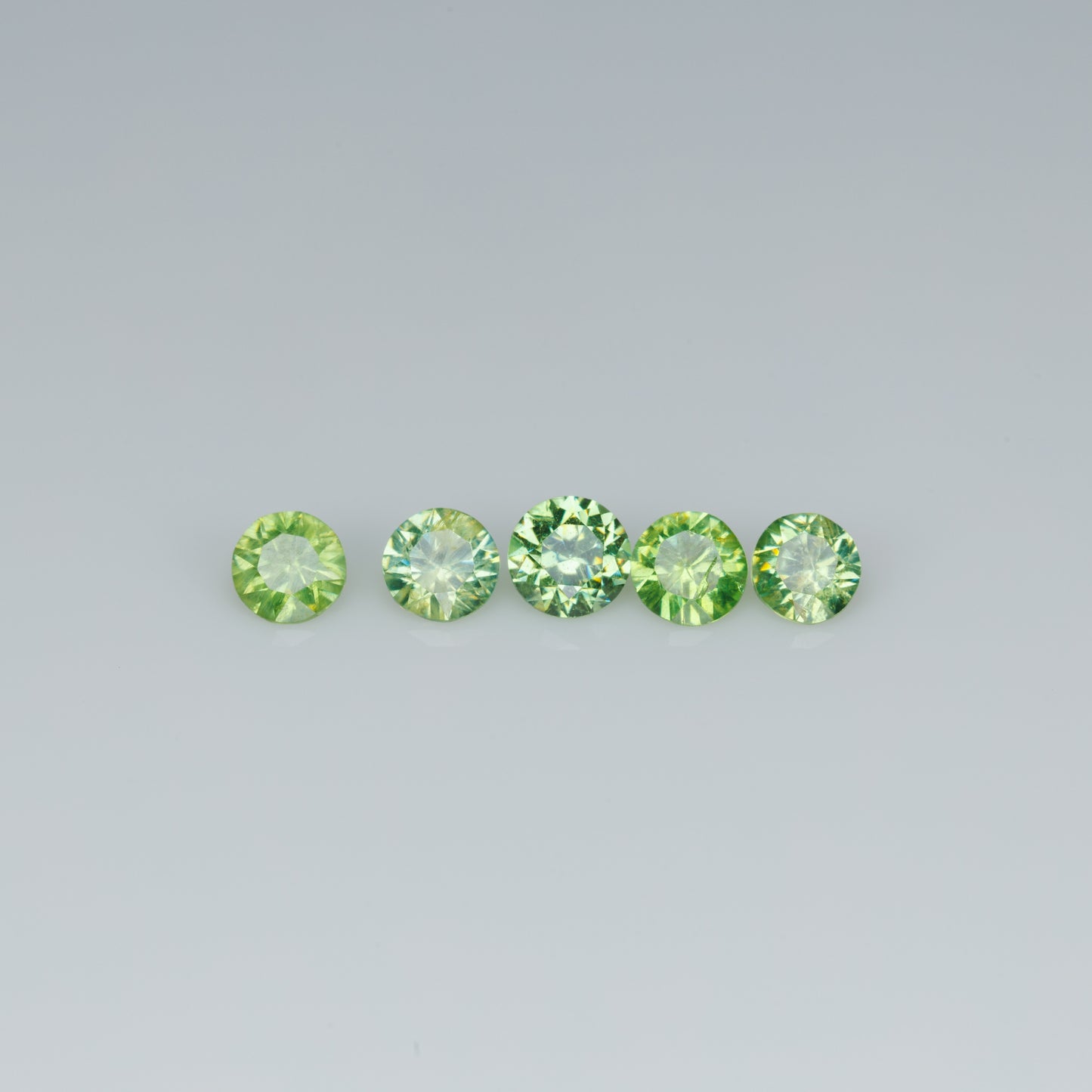 0.48 ct faceted russian demantoid garnet set