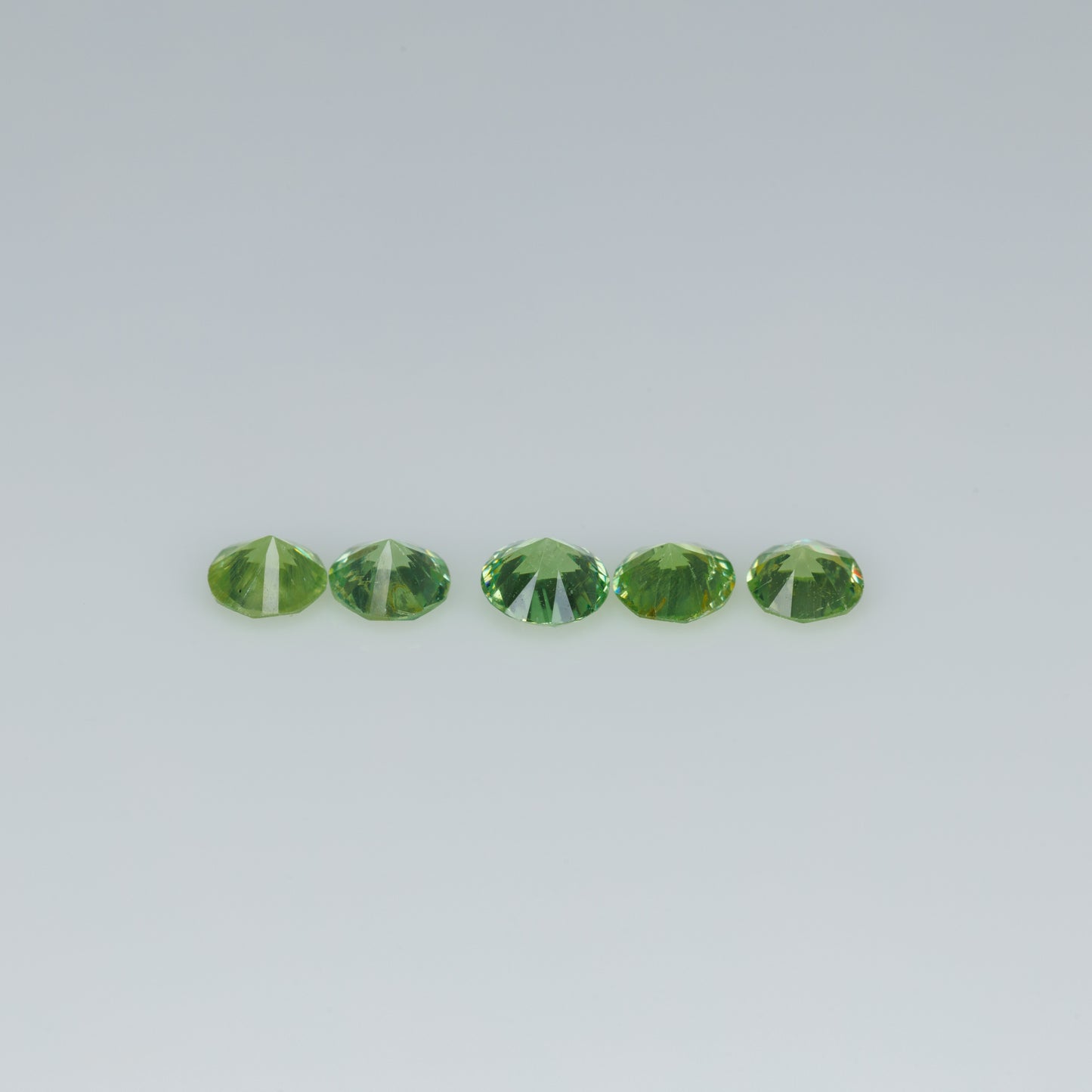 0.48 ct faceted russian demantoid garnet set
