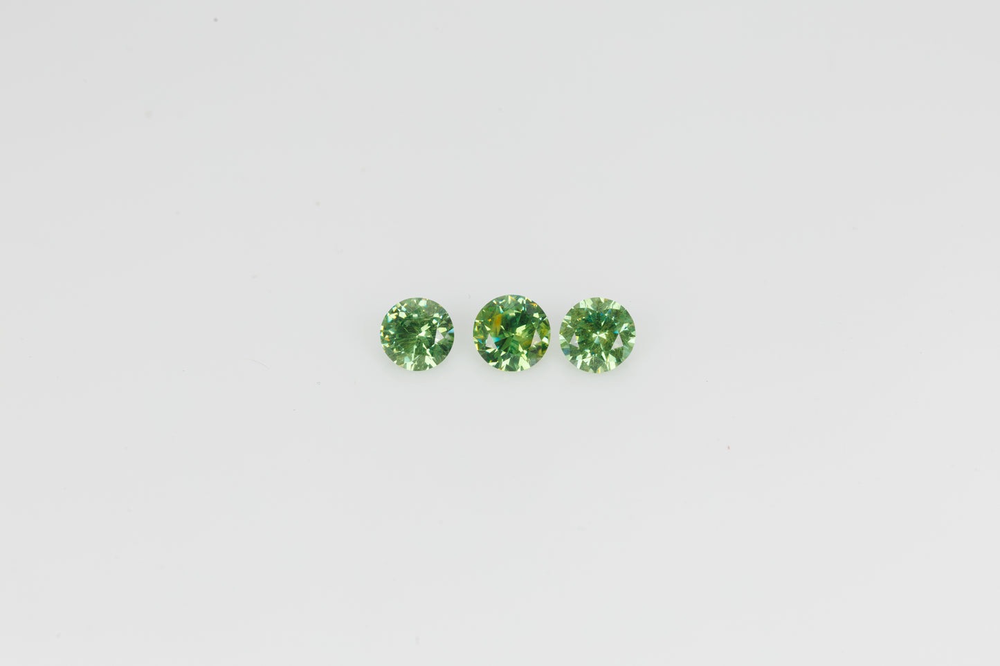 Faceted Russian demantoid pair set