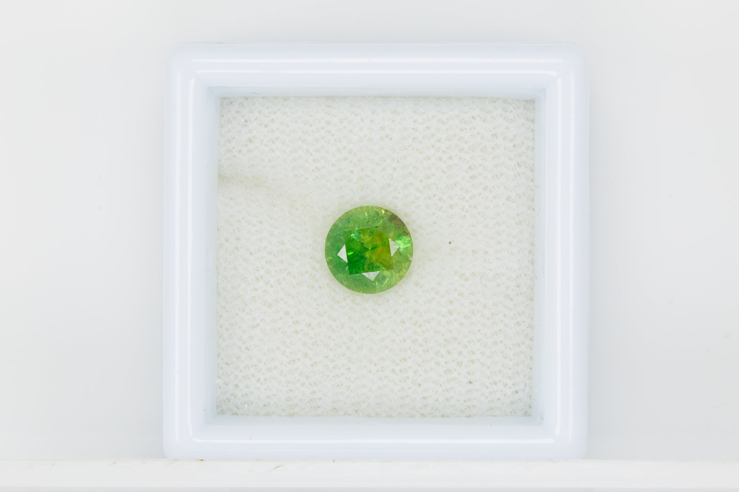 Certified vivid green faceted demantoid garnet, 1.15 ct