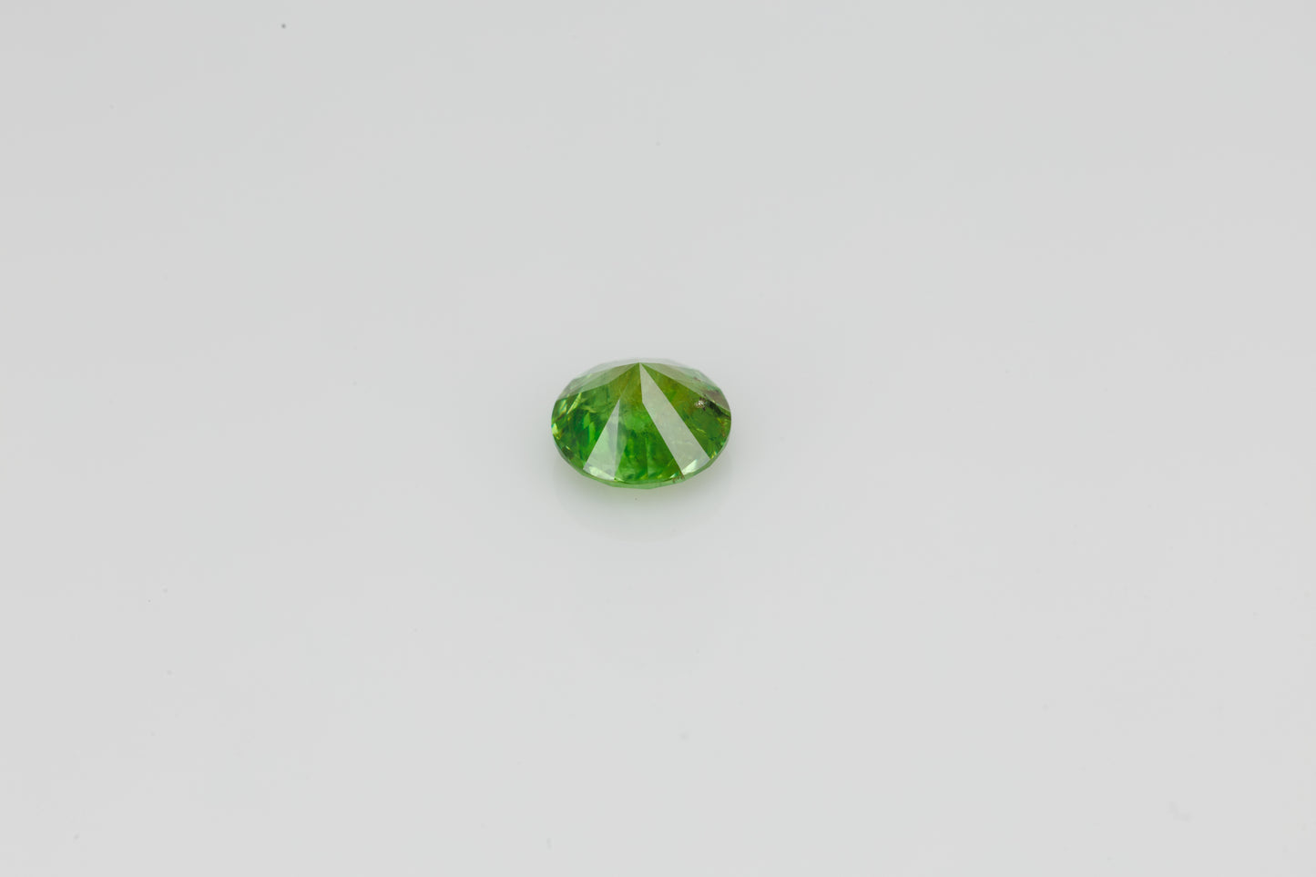 Certified vivid green faceted demantoid garnet, 1.15 ct