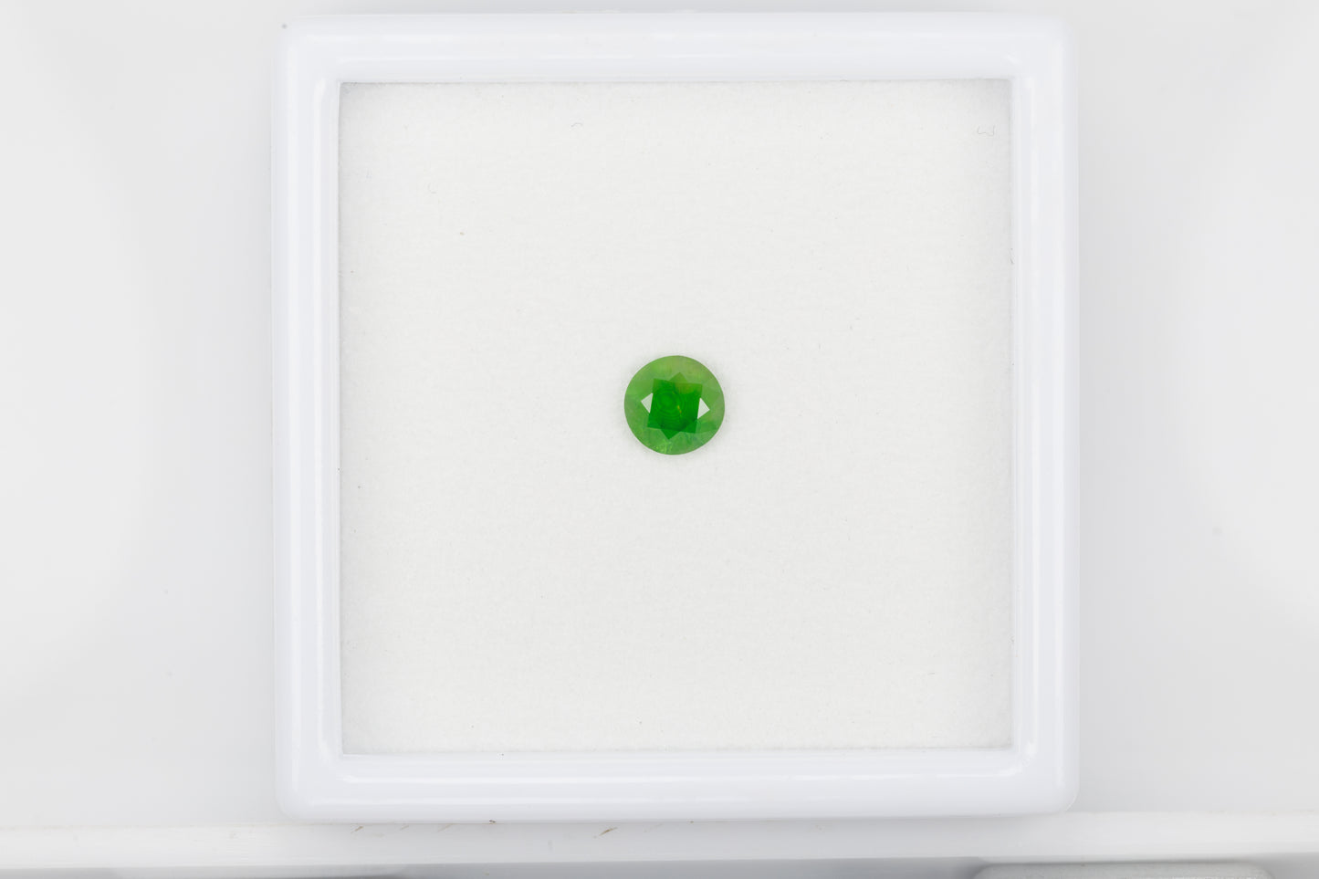 Vivid green faceted demantoid garnet, 0.475 ct