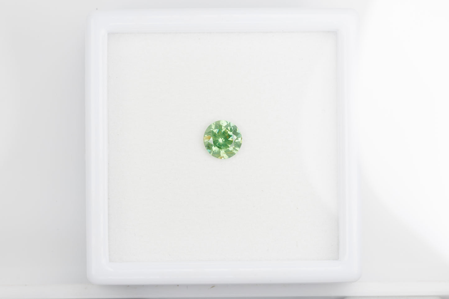Faceted demantoid garnet, 0.63 ct