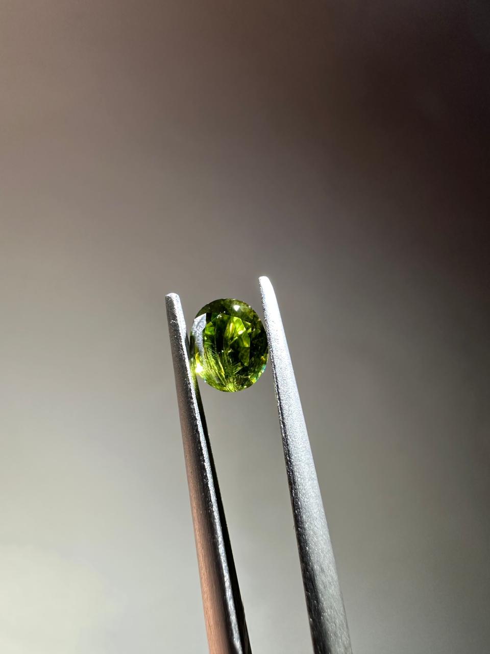 Oval demantoid garnet