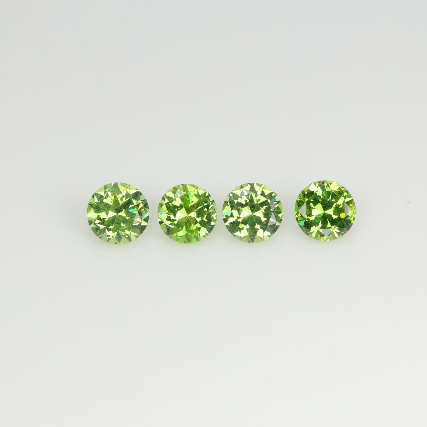 0.93 ct, Faceted demantoid set