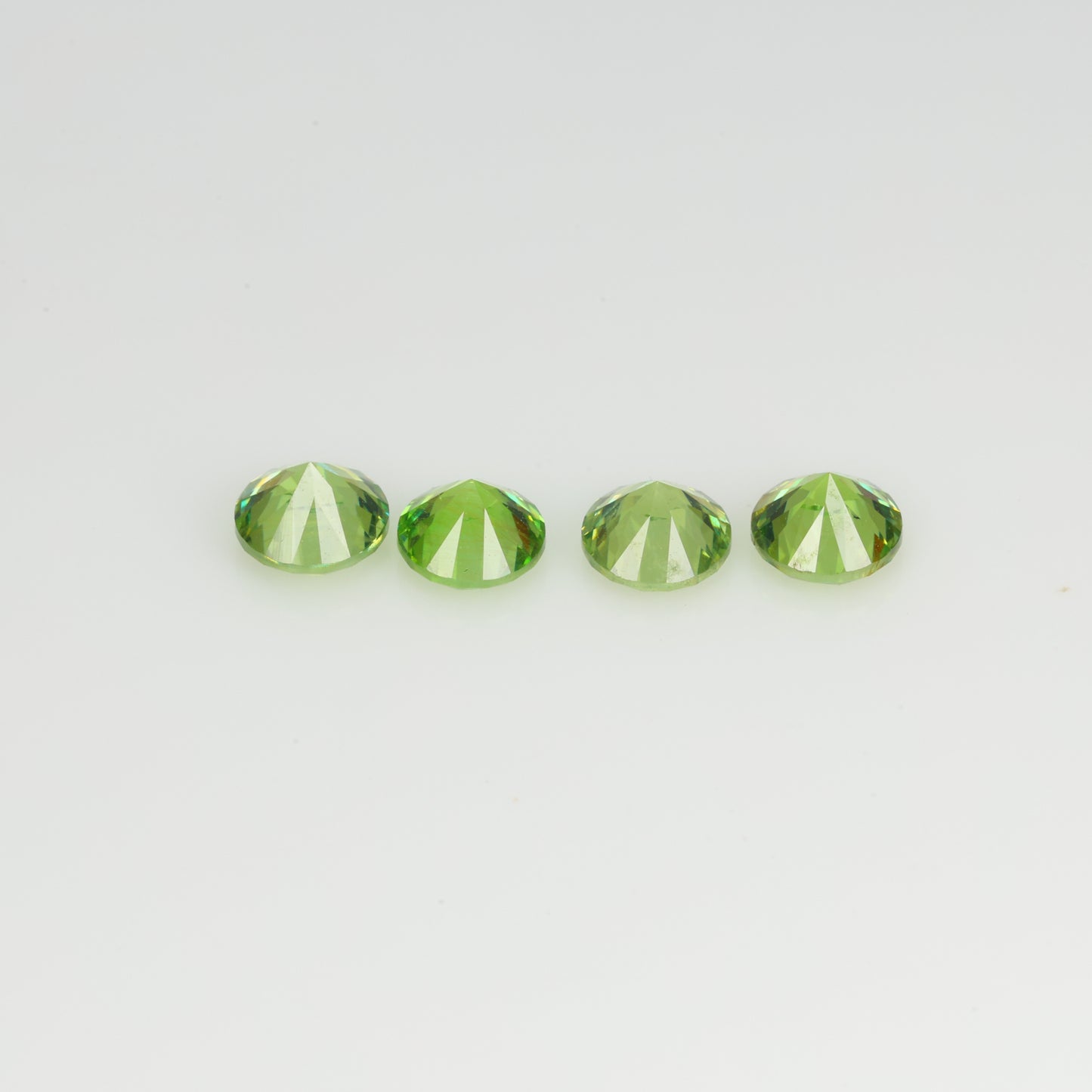 0.93 ct, Faceted demantoid set