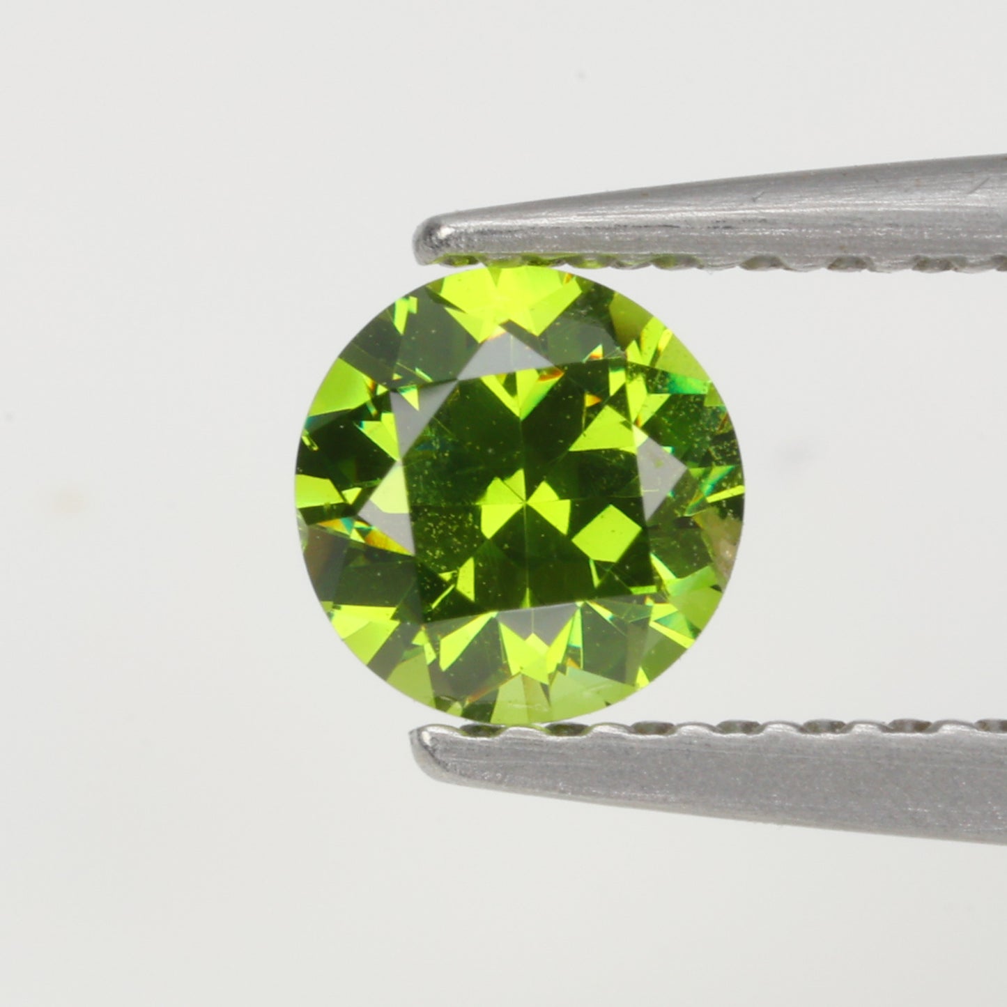 0.45 ct, Faceted Russian demantoid garnet high dispersion
