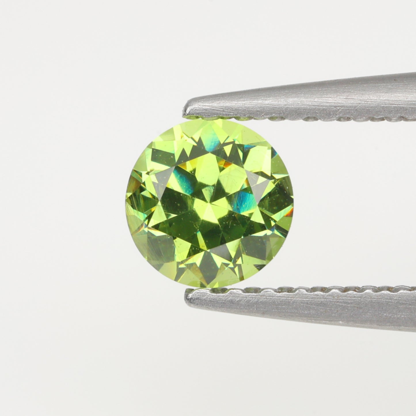 0.39 ct, Faceted Russian demantoid garnet, high dispersion