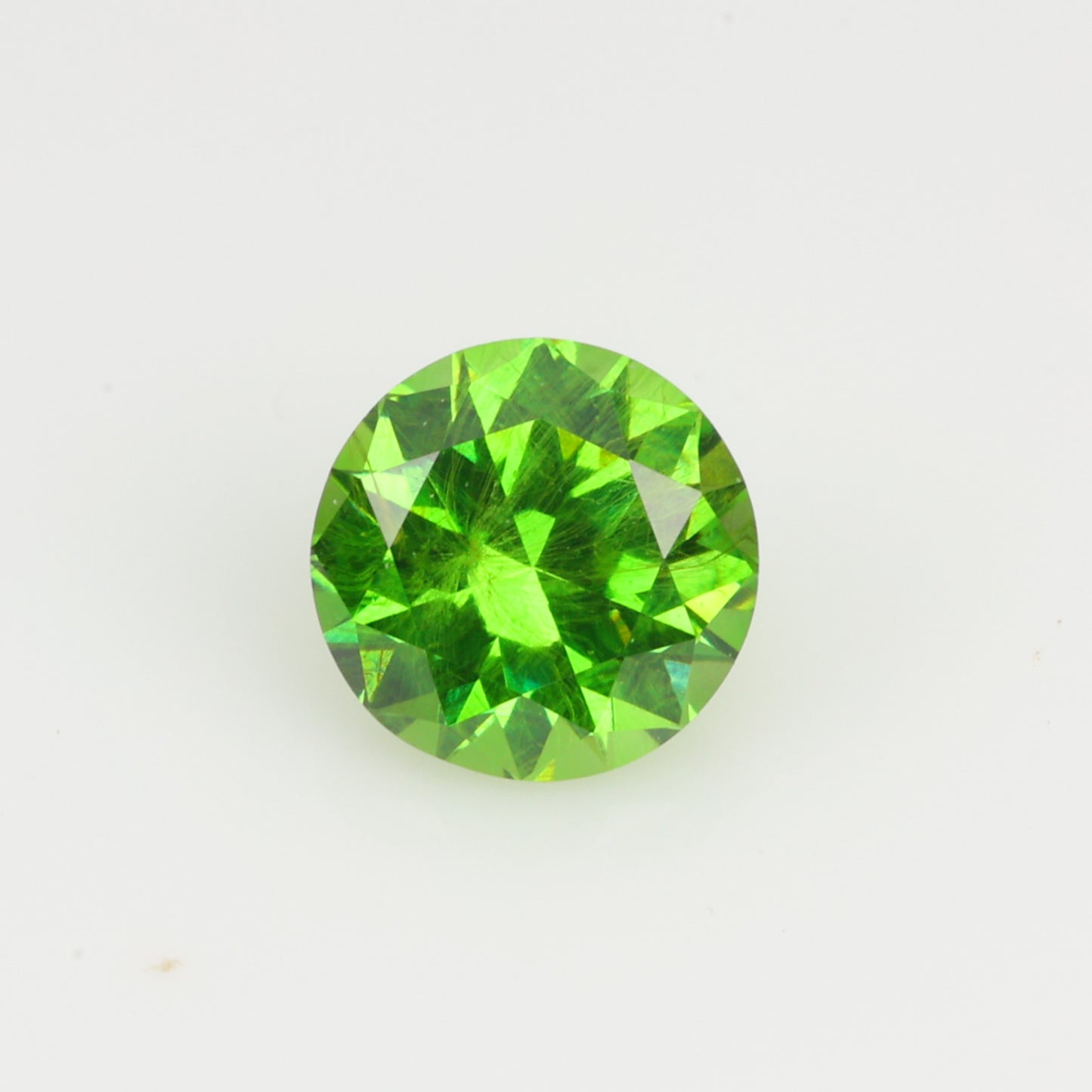 0.34 ct, Faceted Russian demantoid garnet high dispersion