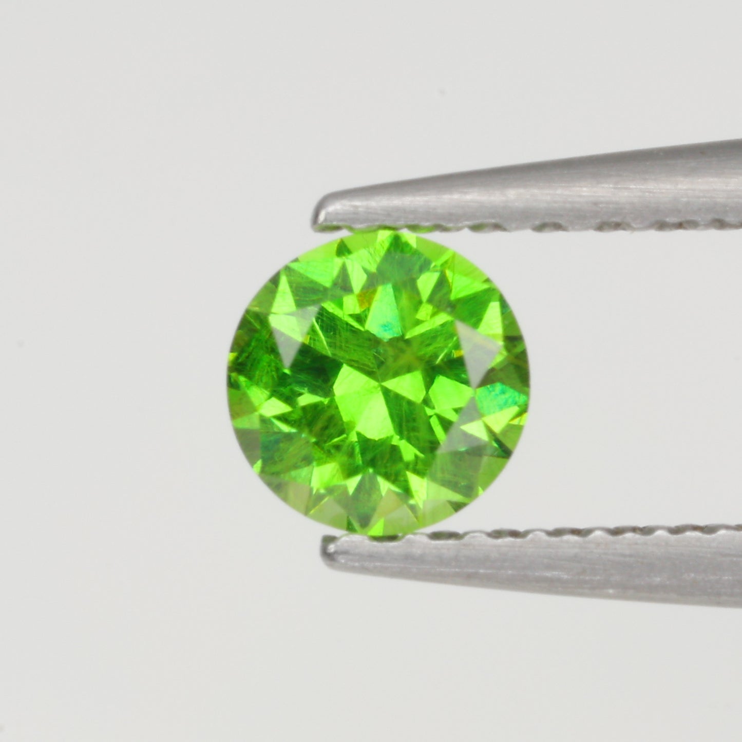 0.34 ct, Faceted Russian demantoid garnet high dispersion