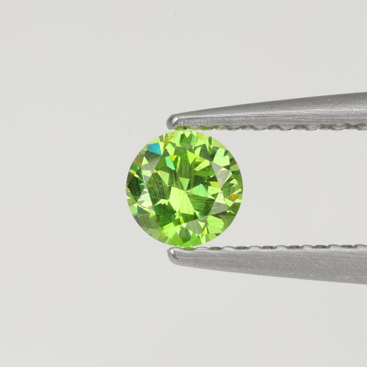 0.27 ct, Faceted Russian demantoid garnet high dispersion