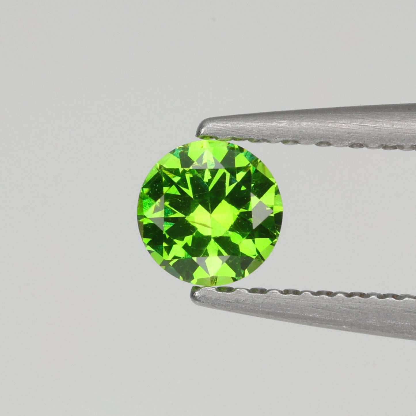 0.24 ct, Faceted Russian demantoid garnet high dispersion