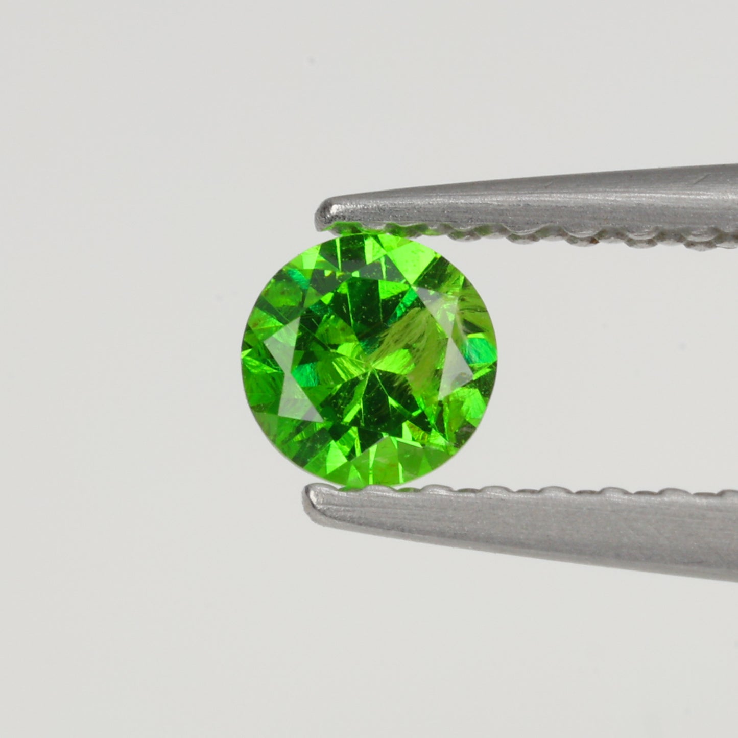 0.22 ct, Faceted Russian demantoid garnet high dispersion