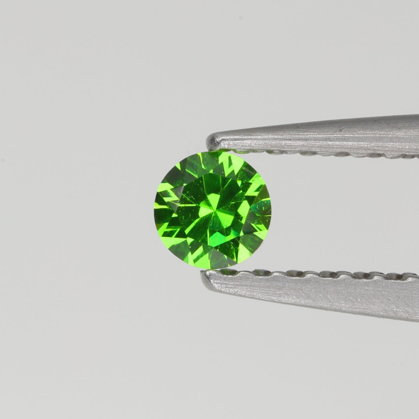 0.14 ct, Faceted Russian demantoid garnet high dispersion
