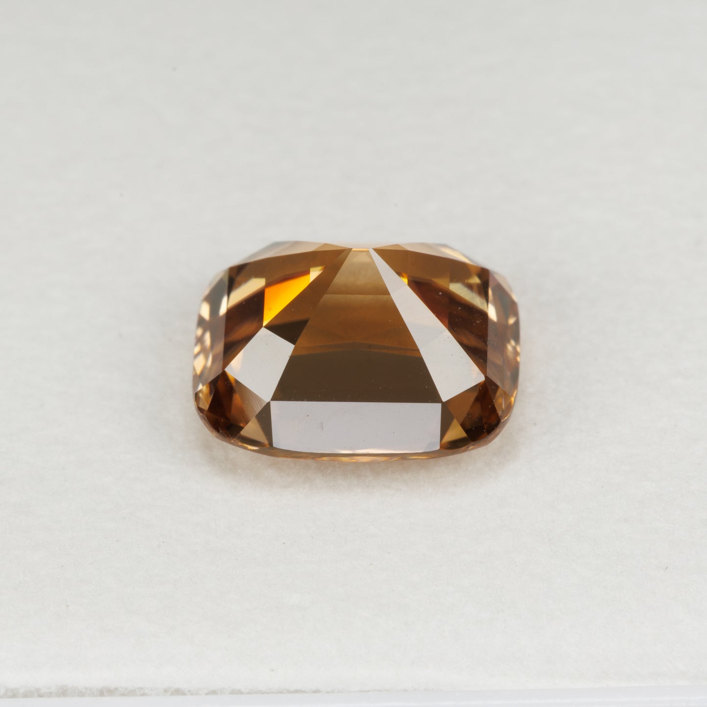 5.94 cts, Facted yellowish orange zircon cushion shape, perfect cut