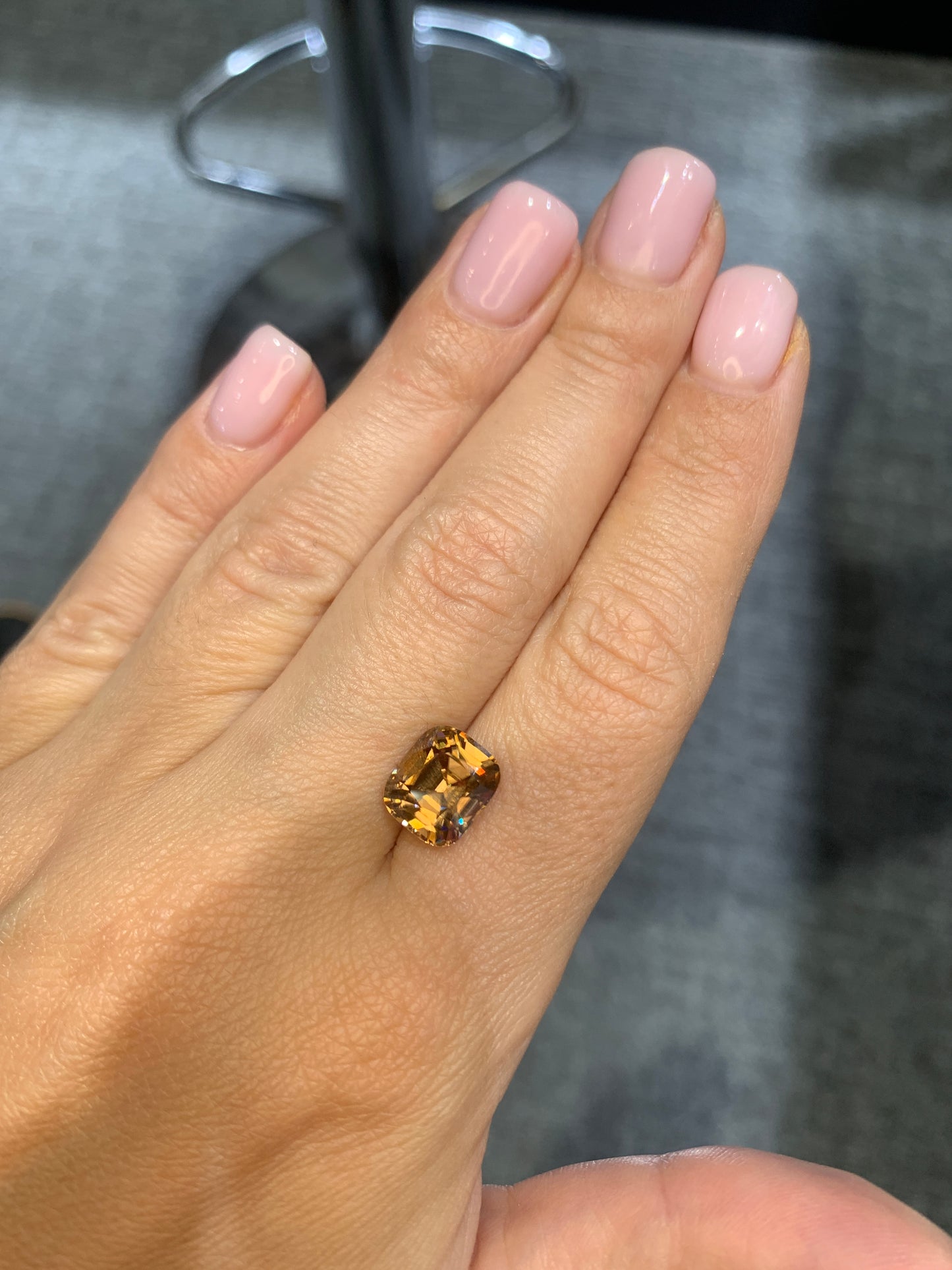 5.94 cts, Facted yellowish orange zircon cushion shape, perfect cut