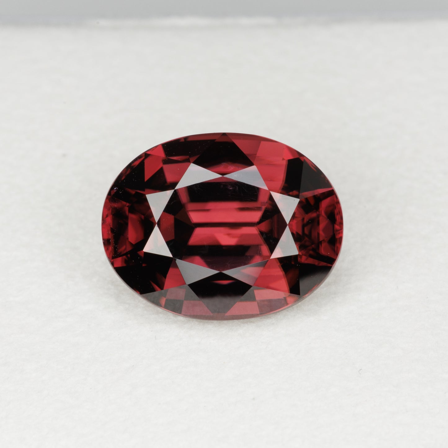 7.08 cts, Faceted oval red zircon