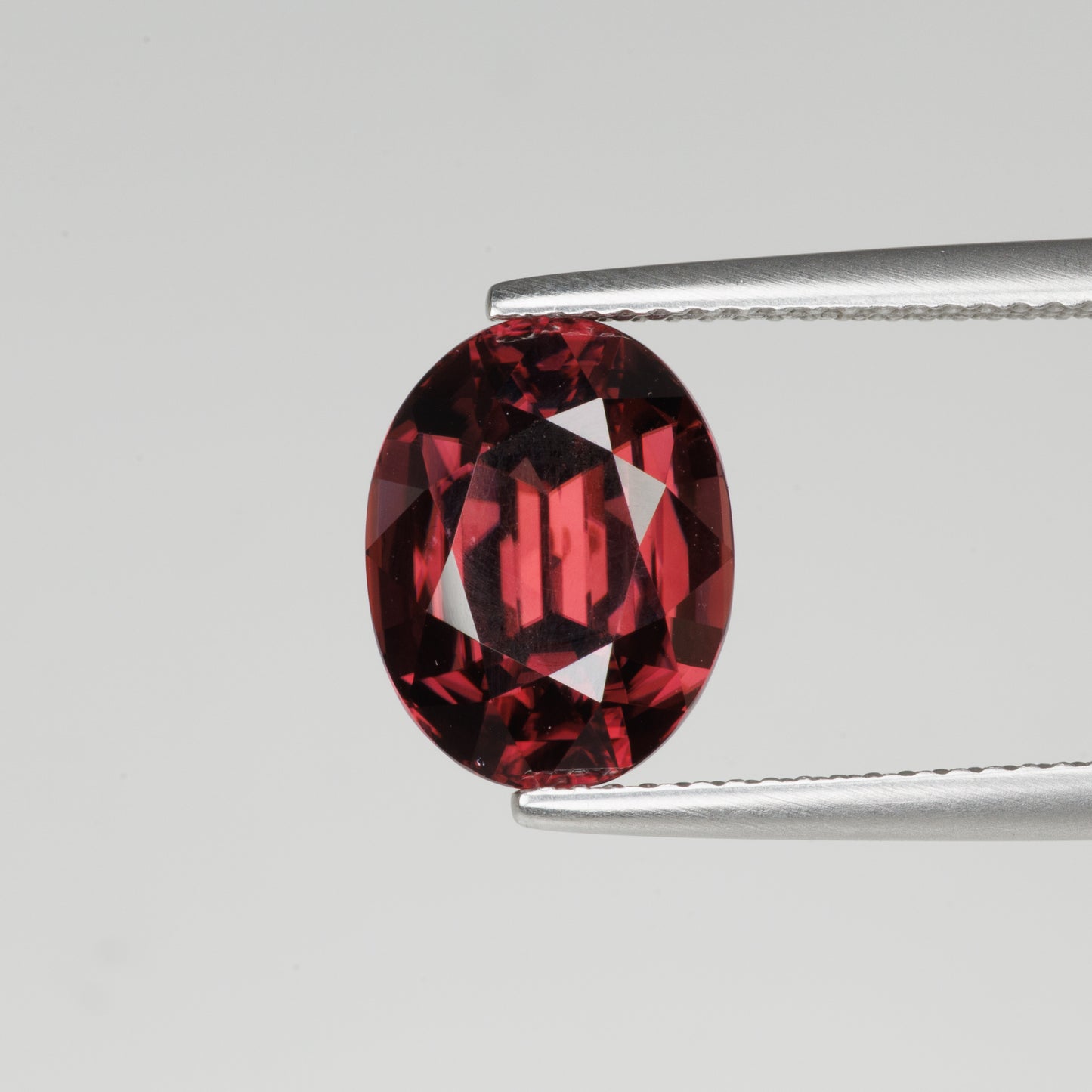 7.08 cts, Faceted oval red zircon