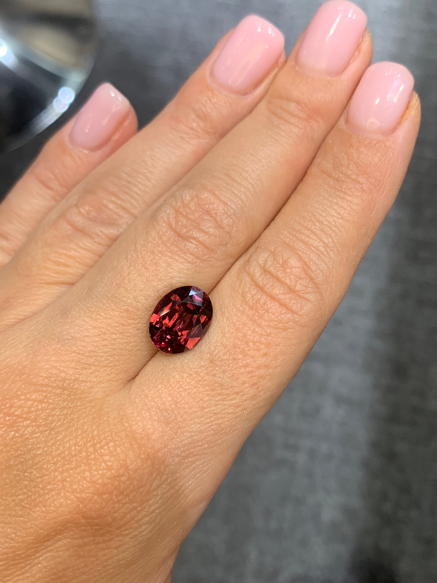 7.08 cts, Faceted oval red zircon