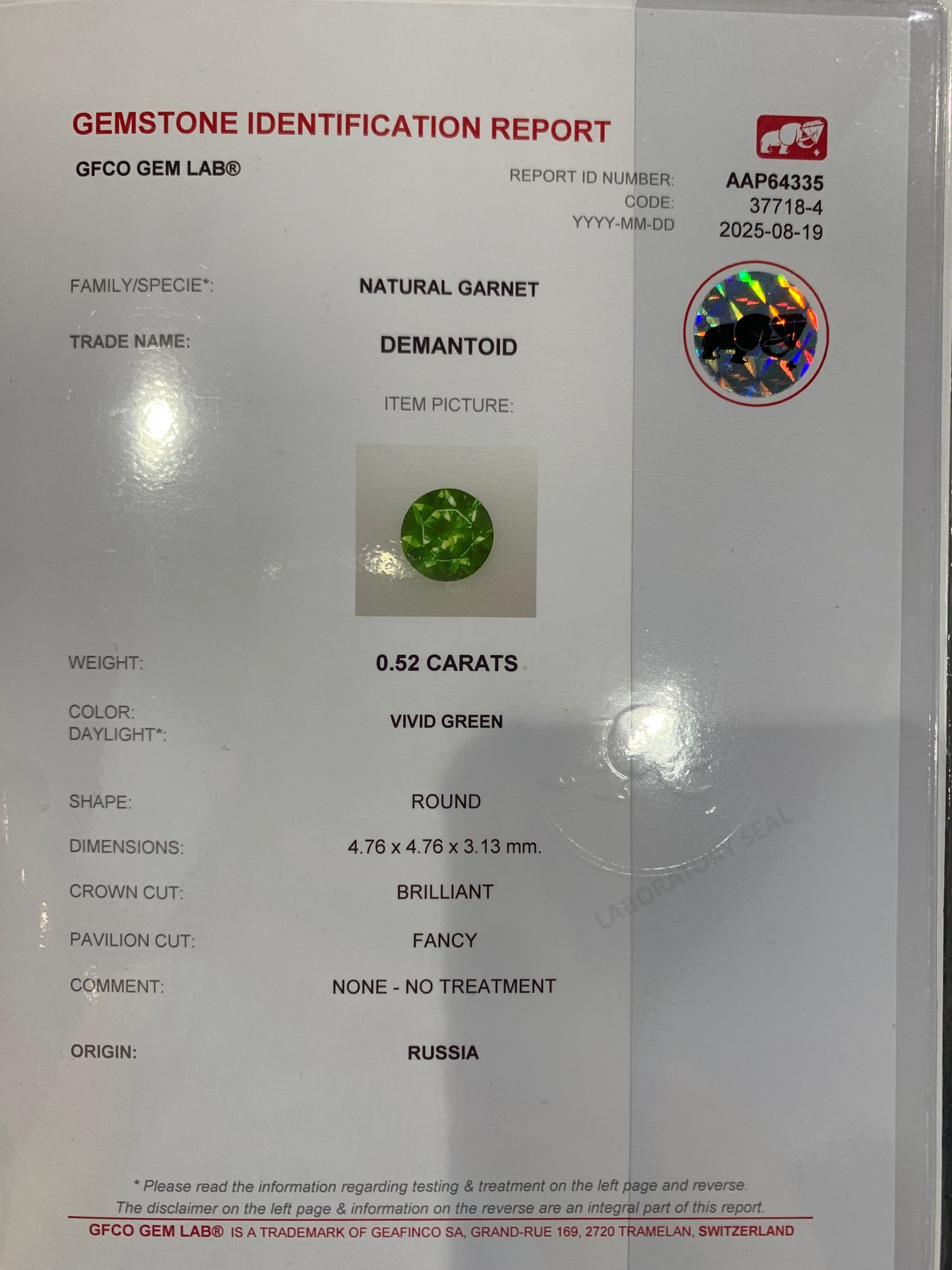 0.52cts, Faceted vivid green Rusisan demantoid garnet with horsetail inclusion