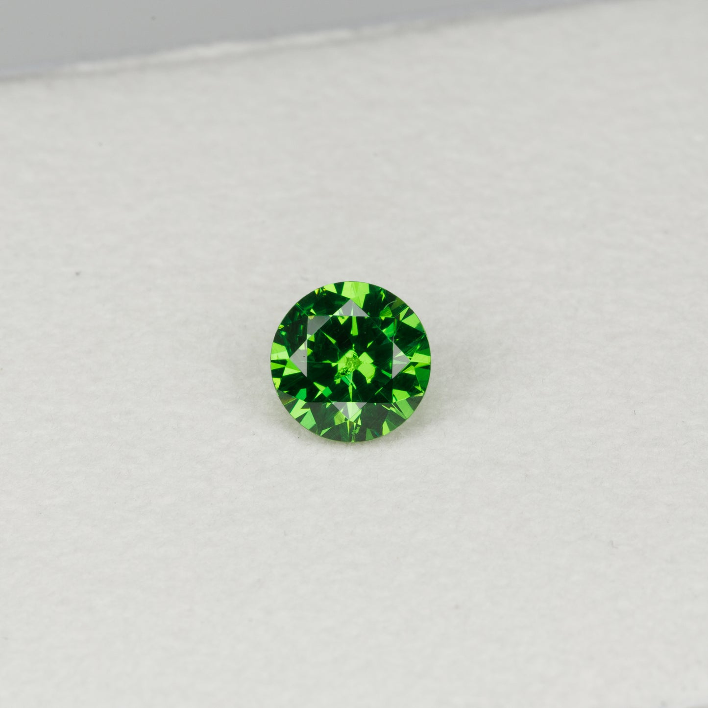 0.6 cts, Faceted vivid green Rusisan demantoid garnet
