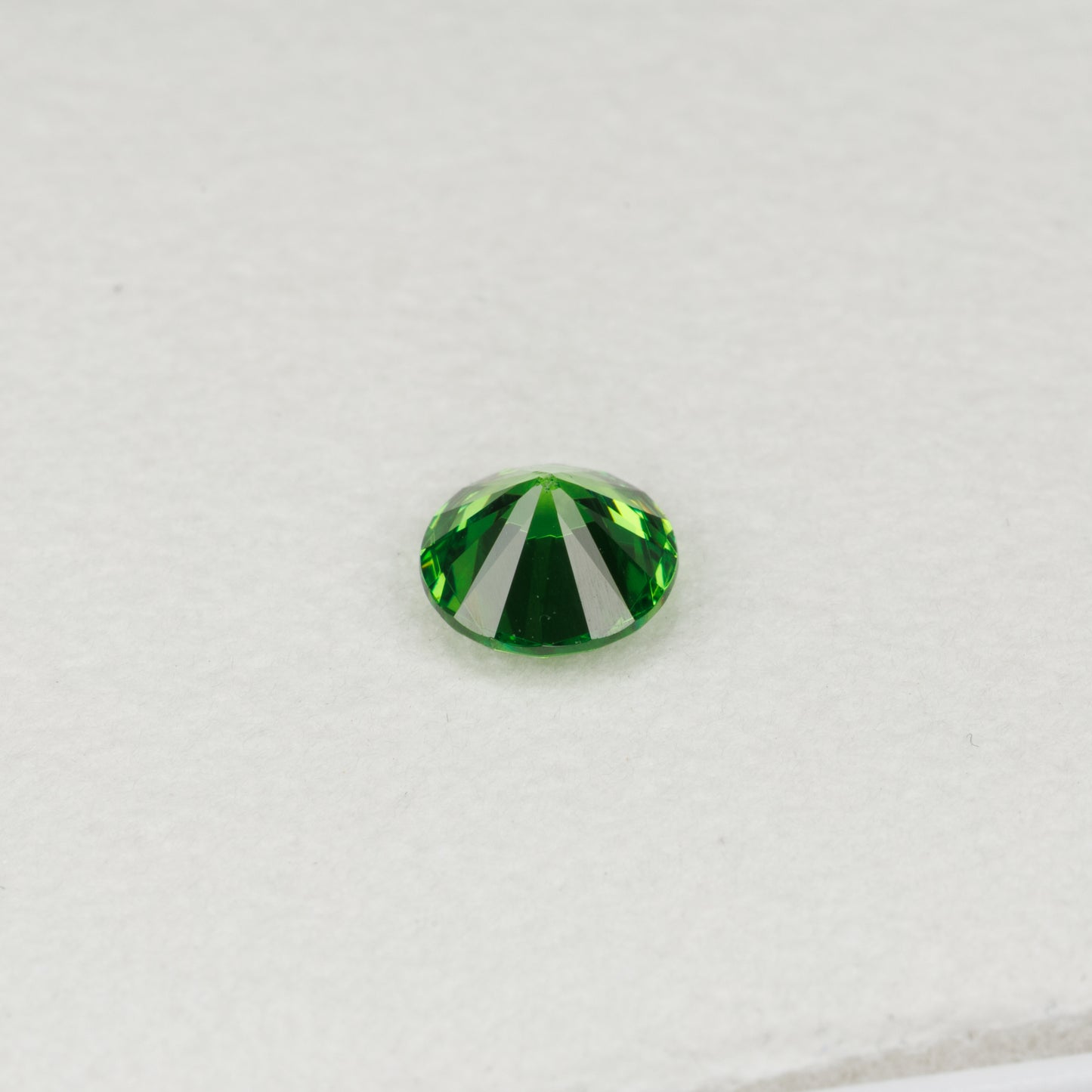 0.6 cts, Faceted vivid green Rusisan demantoid garnet