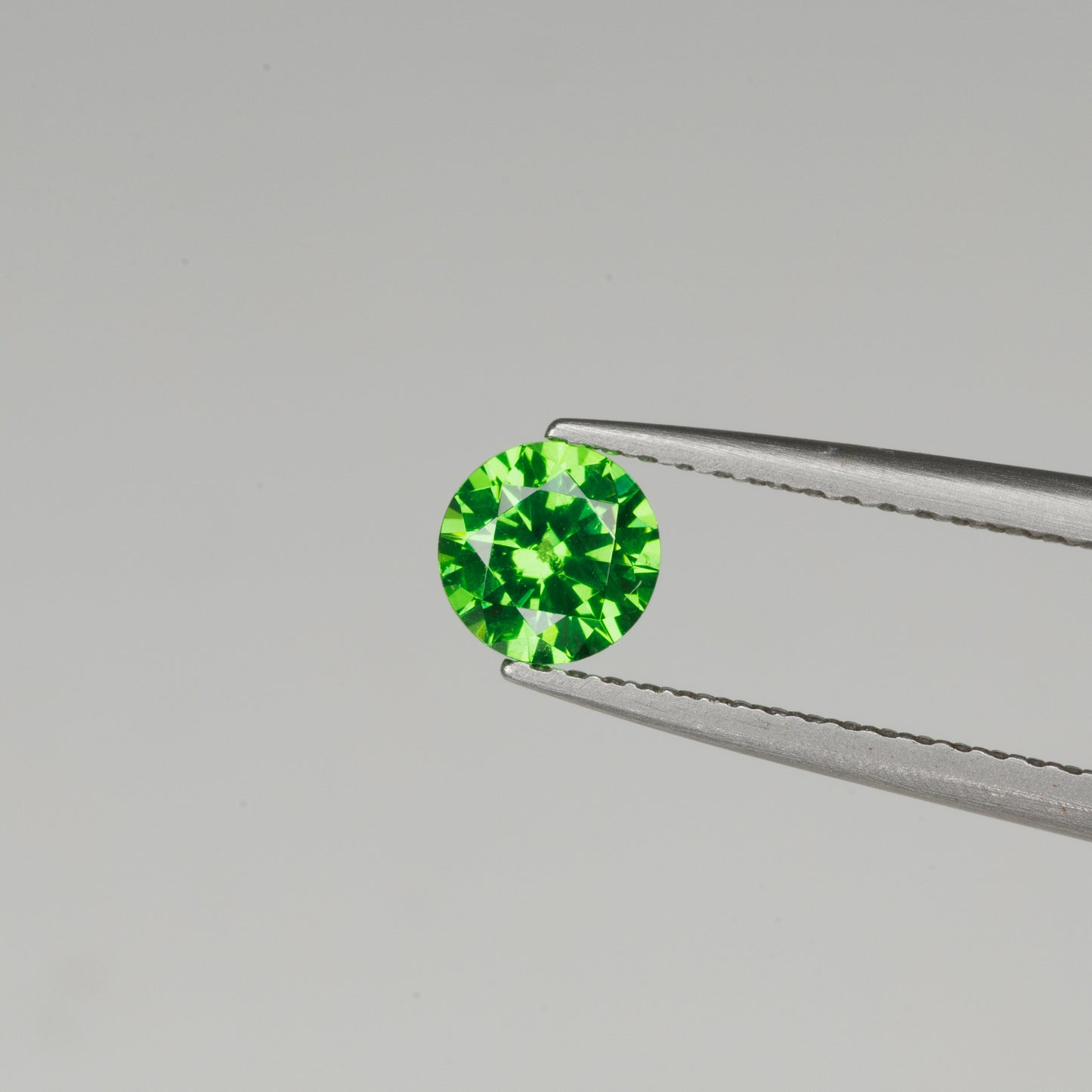 0.6 cts, Faceted vivid green Rusisan demantoid garnet