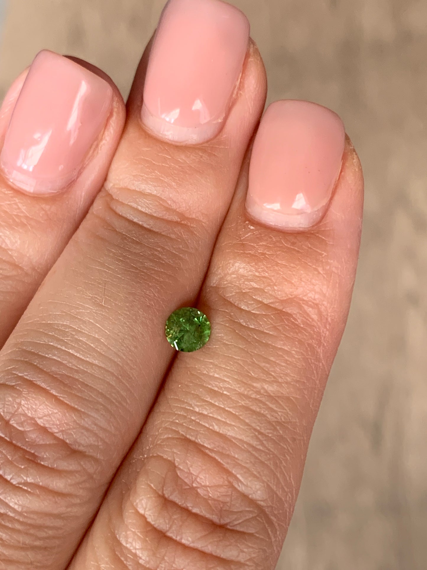 0.44 ct, Faceted Russian Demantoid with bissolite inclusions