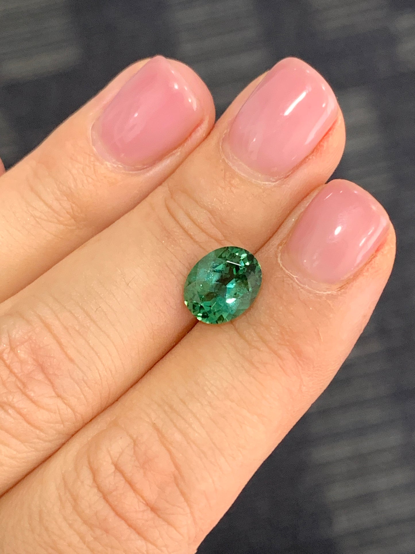 Faceted bluish green oval tourmaline