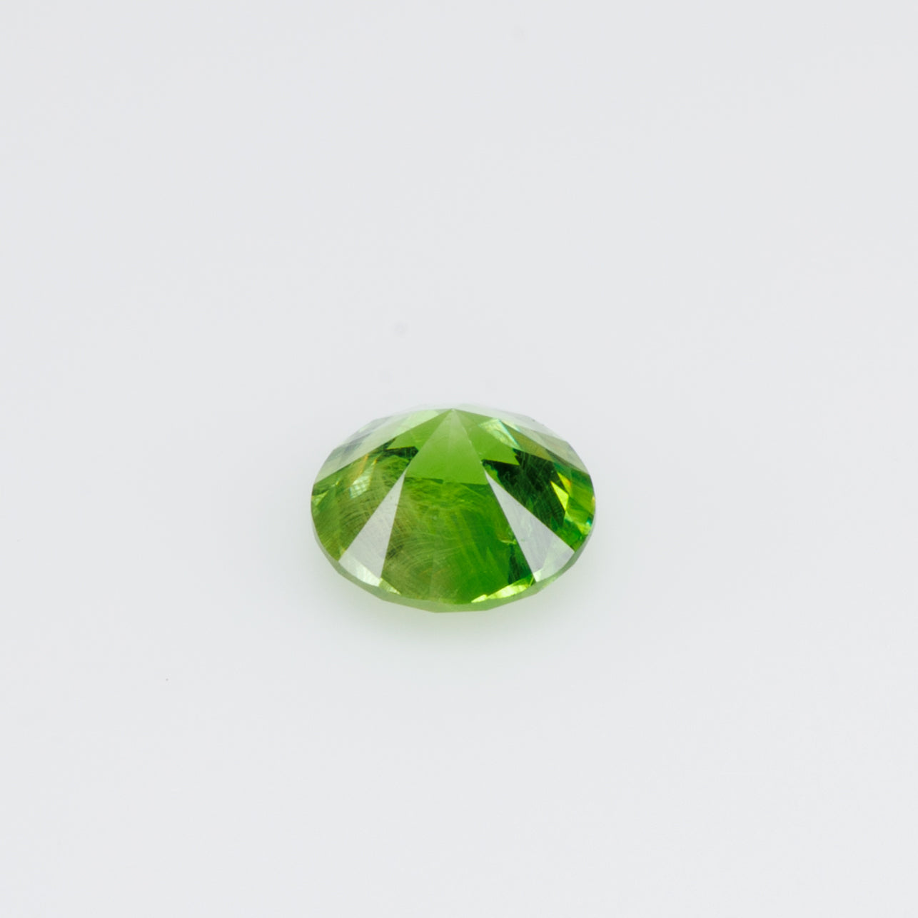 0.26 ct, Russian demantoid garnet with bissolite inclusions