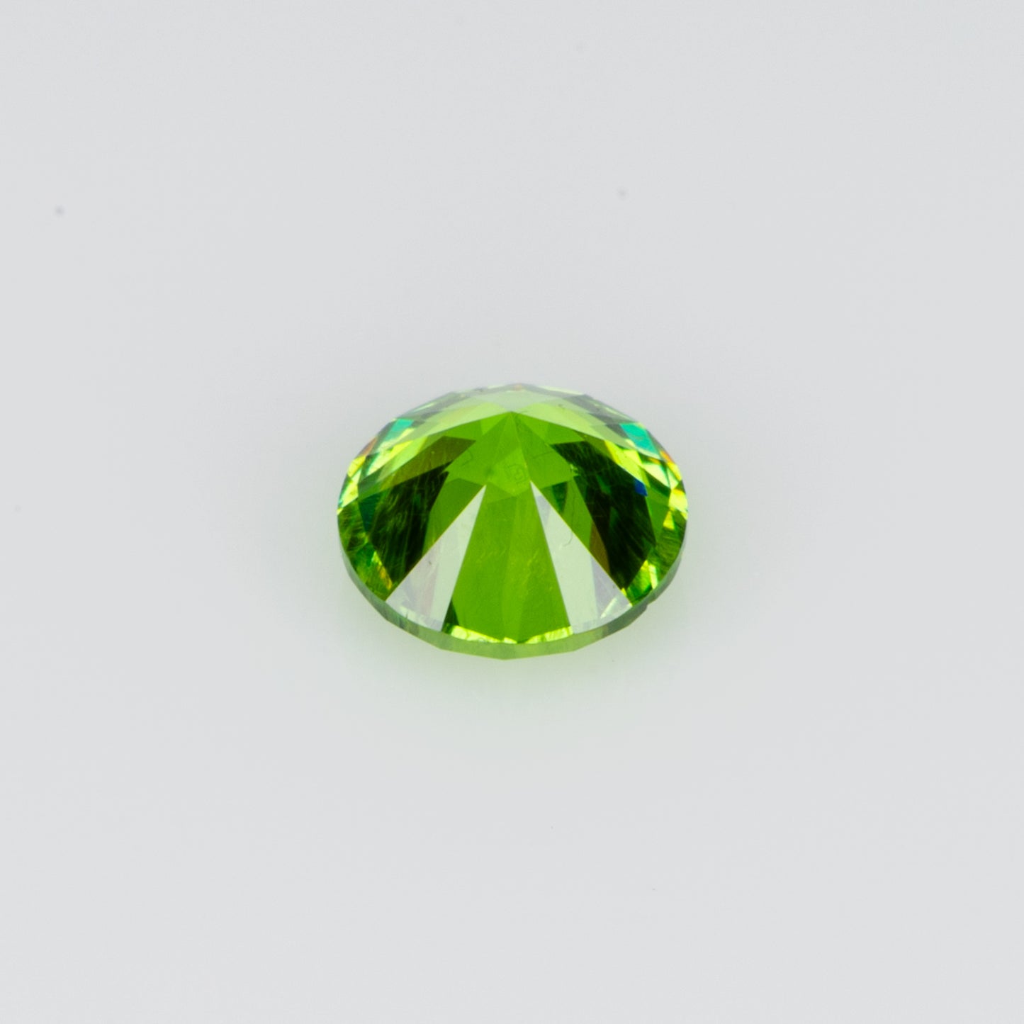 0.14 ct, Tiny vivid green faceted Russian demantoid garnet
