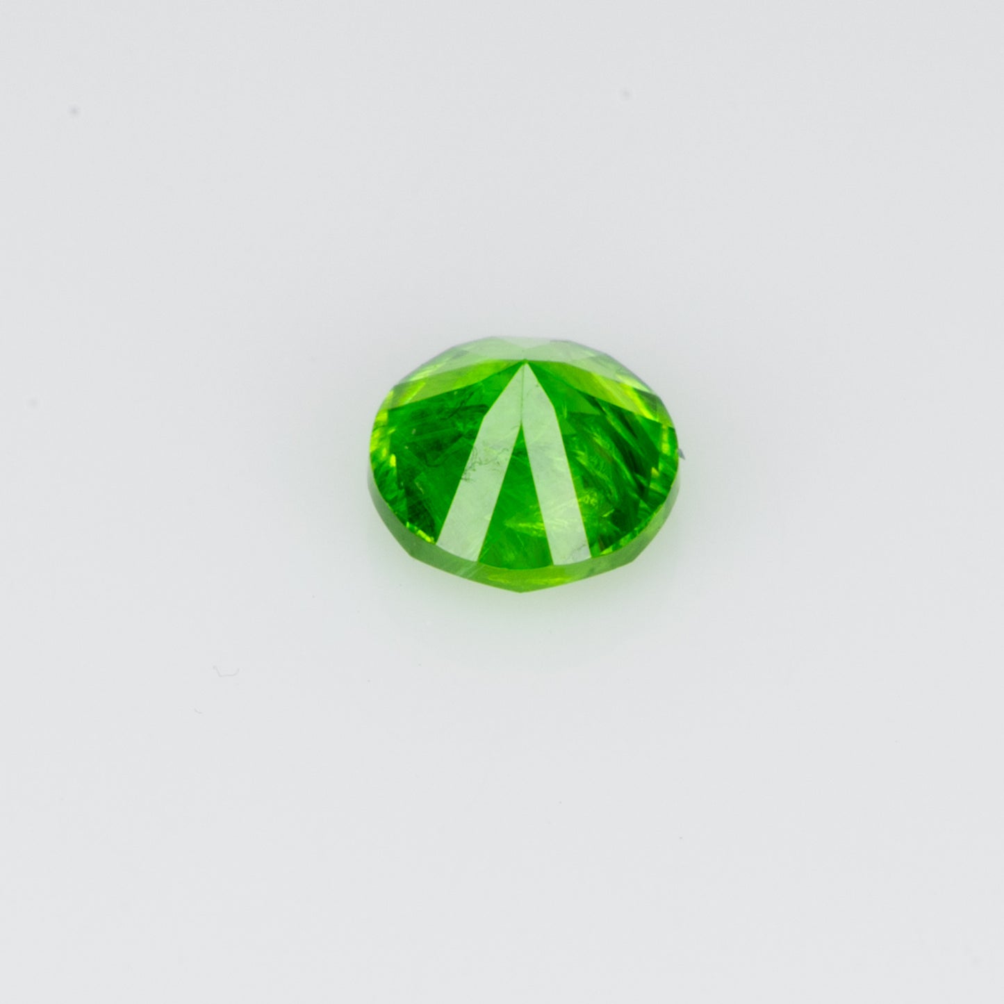 0.12 ct, Tiny vivid green faceted Russian demantoid garnet
