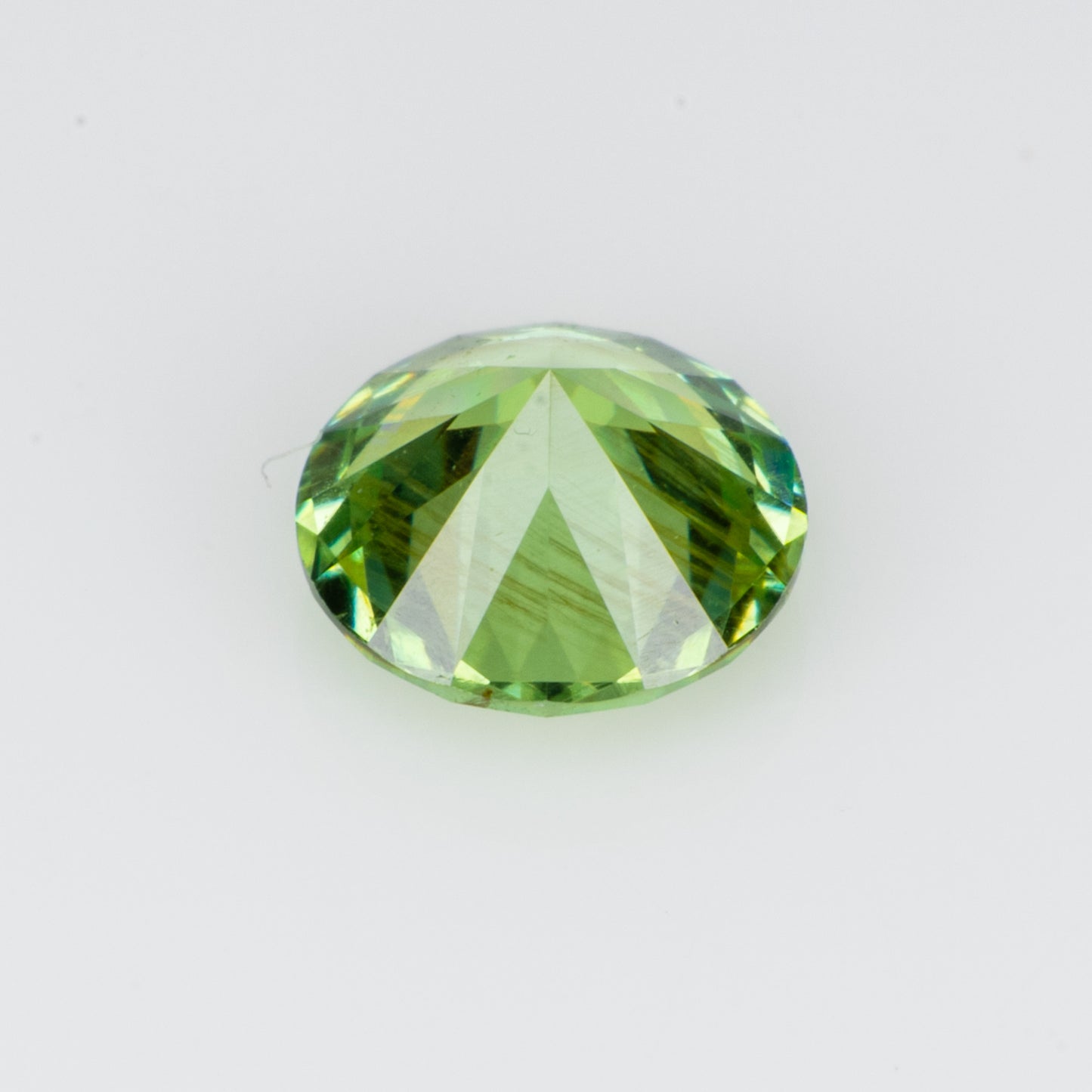 0.34 ct, Faceted Russian demantoid garnet with bissolite inclusions