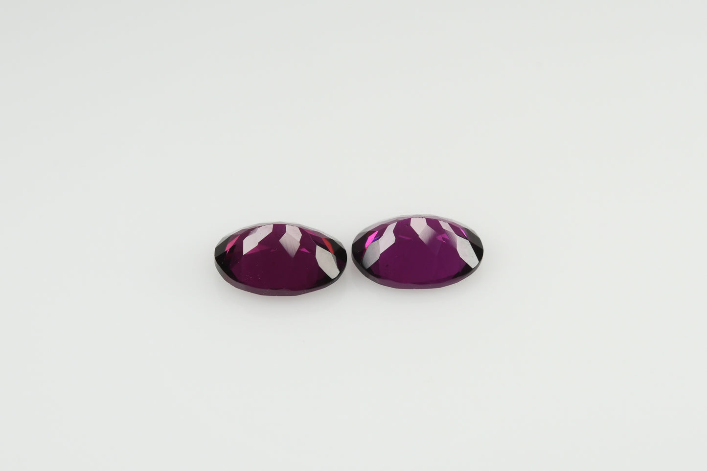 Pair of faceted rhodolite garnets 3.3 ct