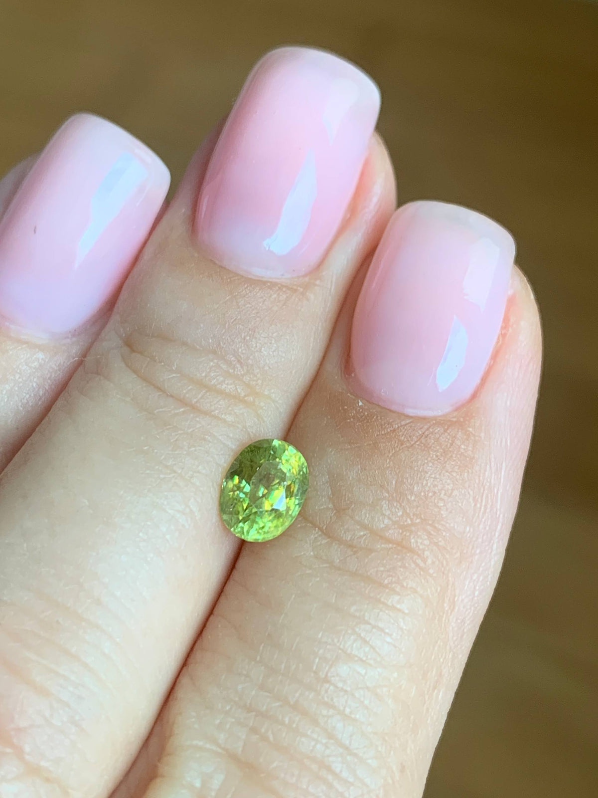 1.22 cts, Faceted yellowish green sphene