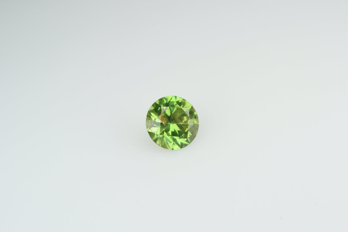 Faceted demantoid garnet 0.5 ct