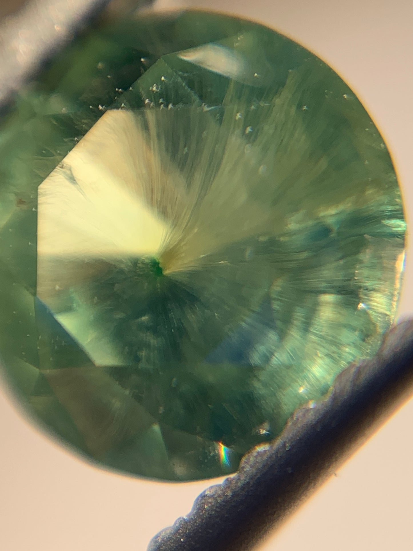 1.12cts Faceted Russian demantoid garnet with horsetail inclusion