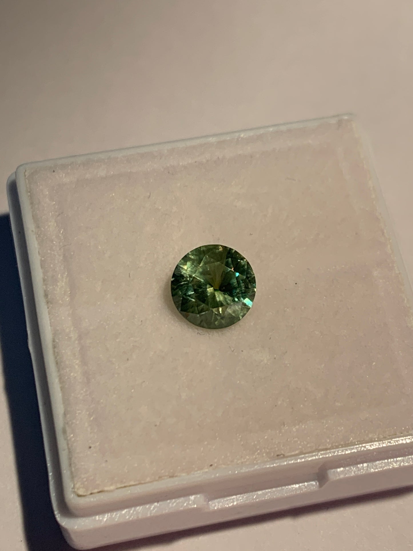 1.12cts Faceted Russian demantoid garnet with horsetail inclusion