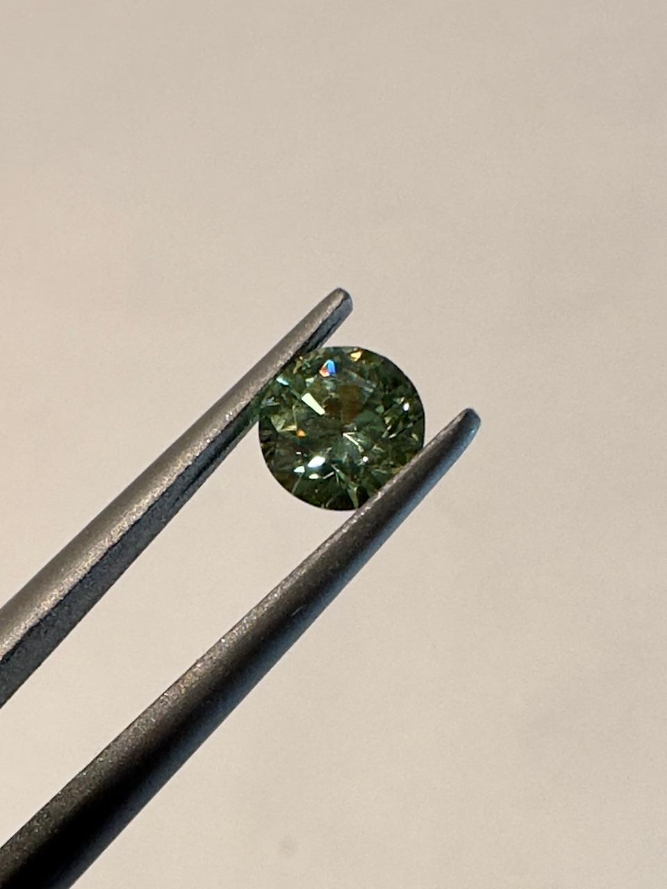 Faceted demantoid 0.6 ct