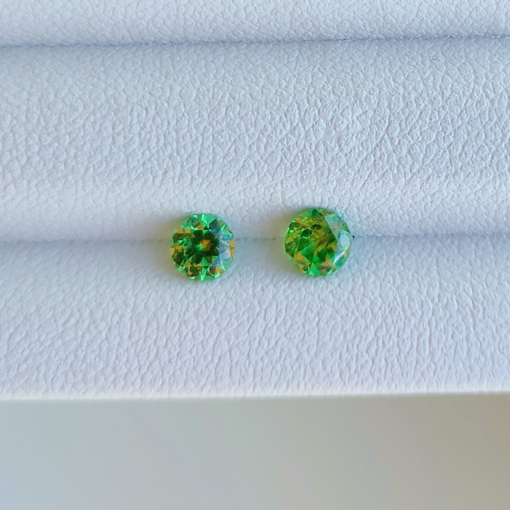 Faceted pair demantoid garnet 0.13 ct