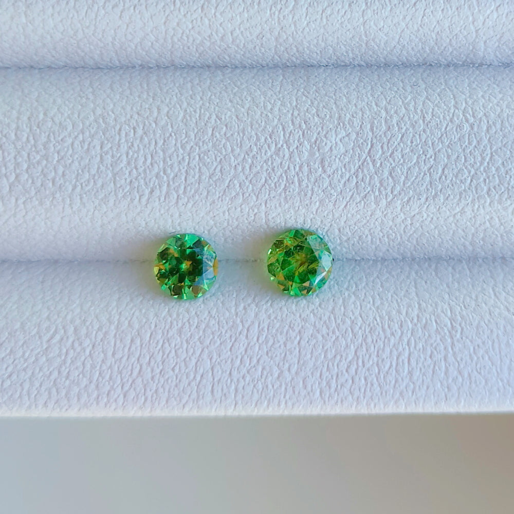 Faceted pair demantoid garnet 0.13 ct