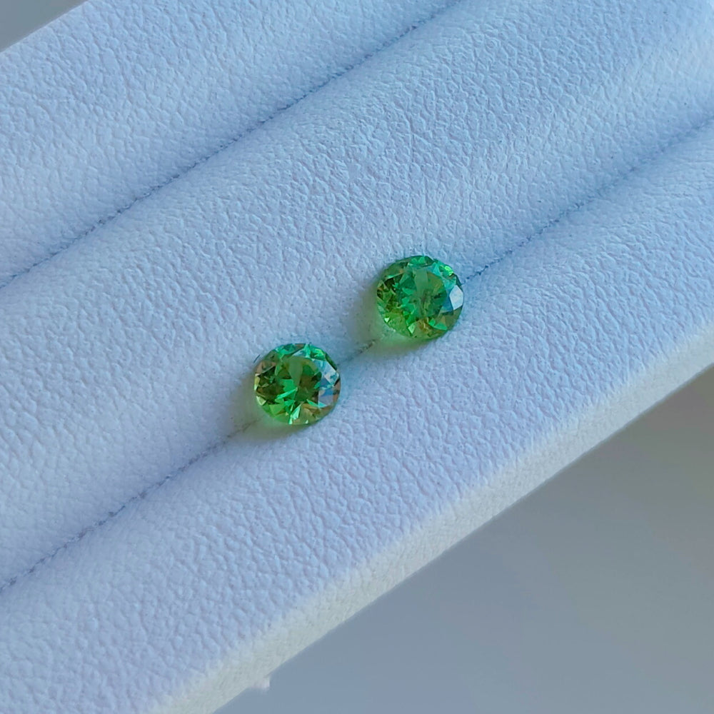 Faceted pair demantoid garnet 0.13 ct