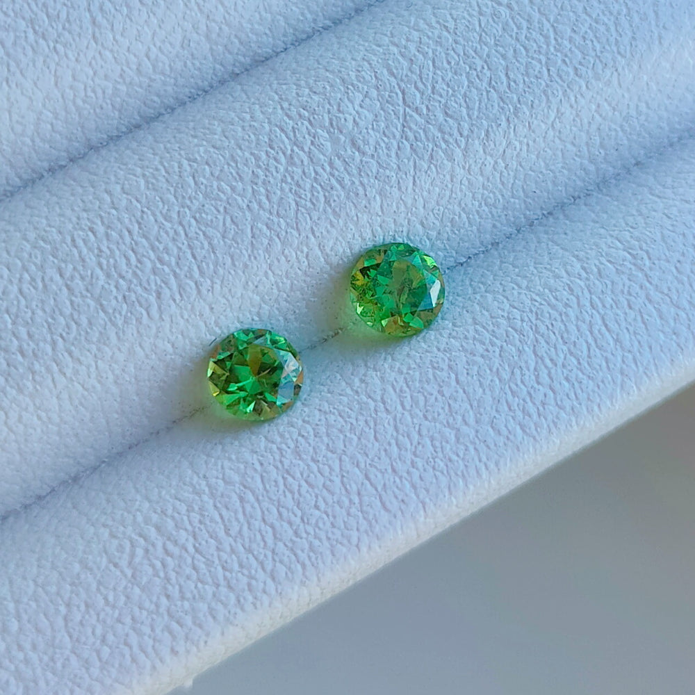 Faceted pair demantoid garnet 0.13 ct
