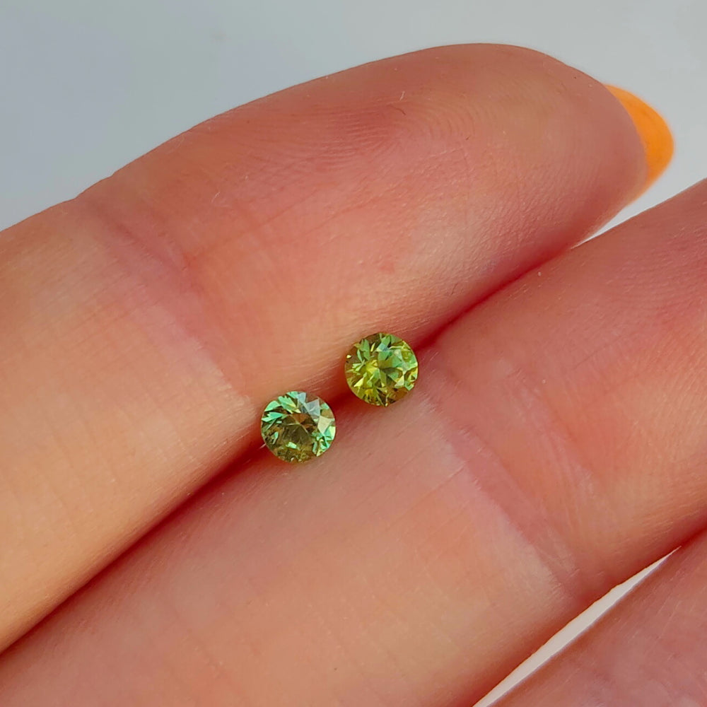 Faceted demantoid pair 0.32 ct