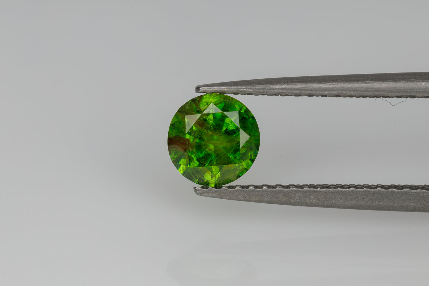 Faceted russian demantoid garnet 0.87 ct
